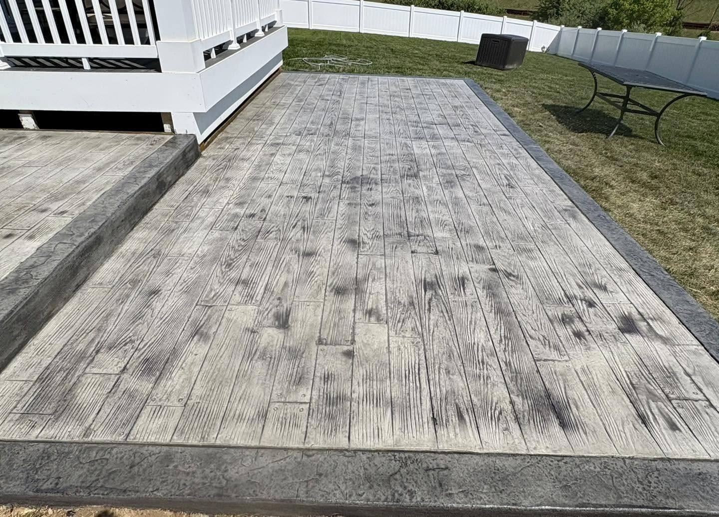 Wood plank stamped concrete slab in a light gray finish in Winchester VA