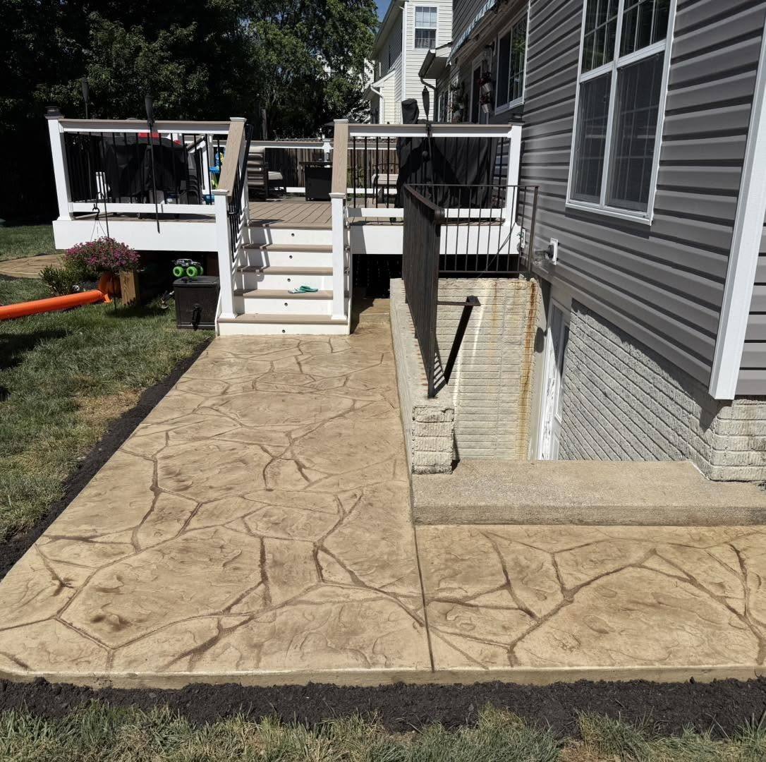 Tan stamped concrete walkway running alongside a home in Winchester VA