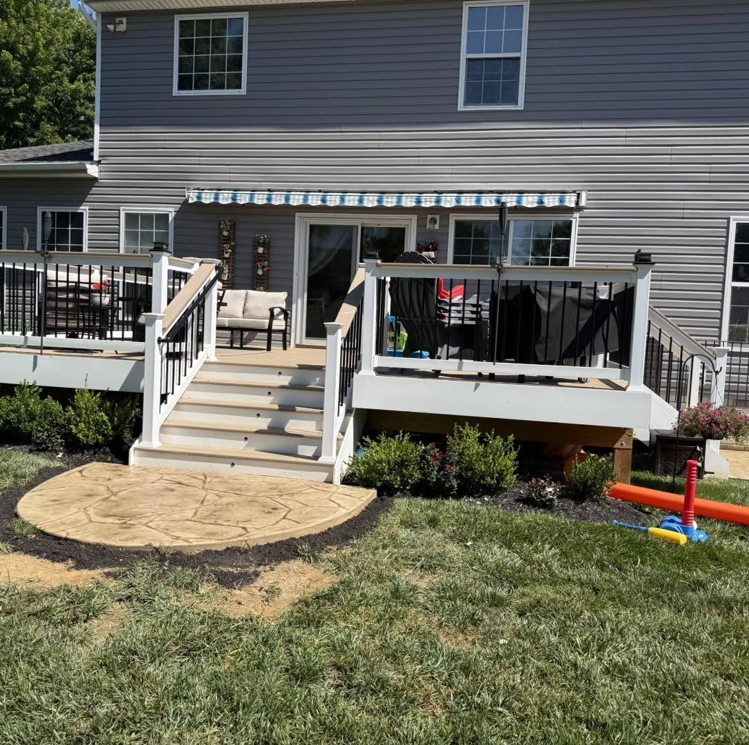 Stamped concrete patio at the foot of a deck staircase in Winchester VA